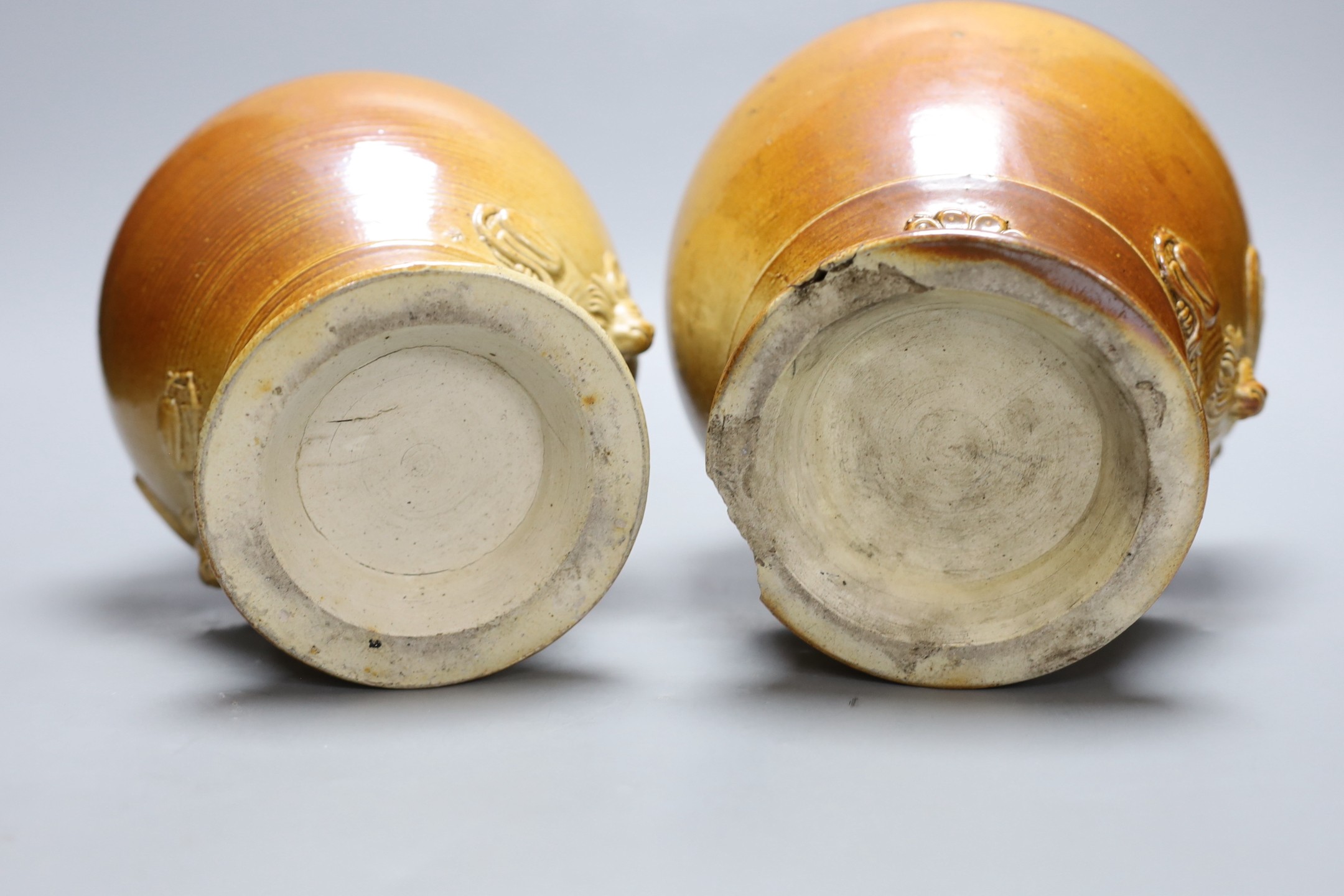 Two 19th century baluster shape salt glazed stoneware storage jars, each with Royal Coat of Arms sprigging, 24cm